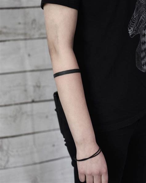 black forearm band tattoo|solid black band tattoo meaning.